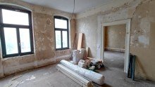 Wohnzimmer (32) Renditestarkes Doppelpaket - Vermietung trifft auf enormes Entwicklungspotenzial